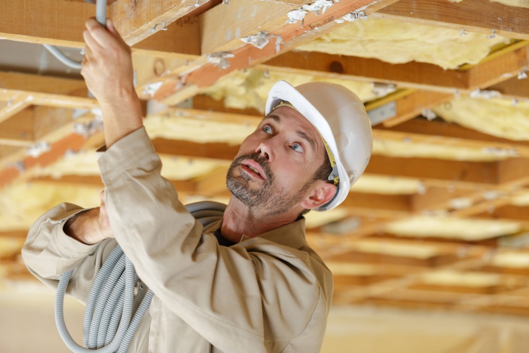 Electrical wires over insulation.  