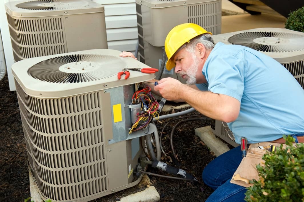 AC unit service repair technician helps take care of the AC unit and look for freon leaks.